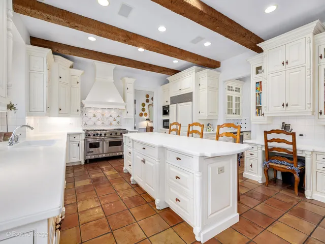 a utility room with cabinets washer and dryer