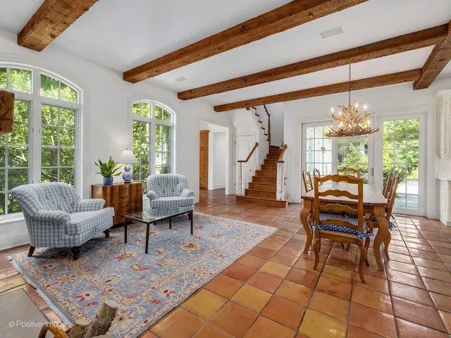 a view of a dining room with furniture wooden floor and chandelier