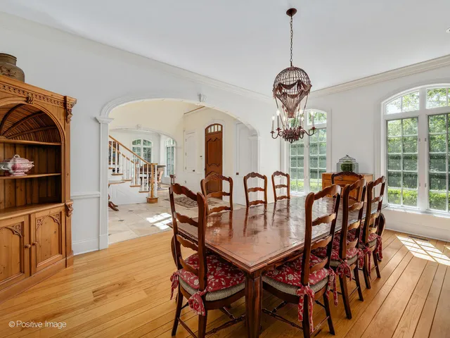 a bathroom with a sink a washer and dryer next to a window