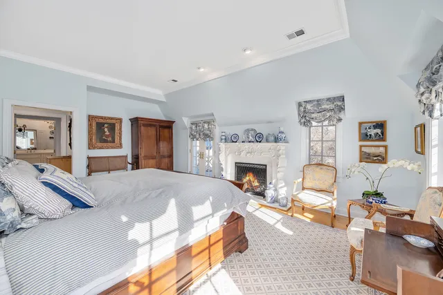 a bedroom with furniture and a window