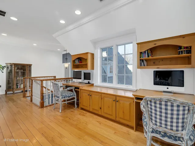 a bathroom with a sink a toilet a mirror and shower