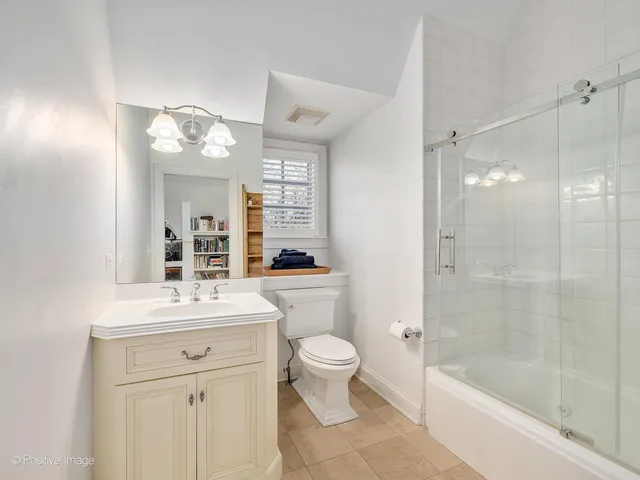 a living room with furniture a table and gym equipment