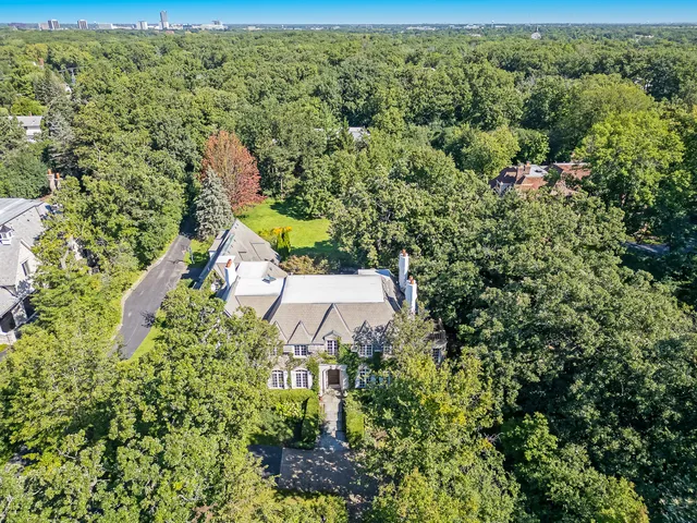 a aerial view of a house with a yard and garden