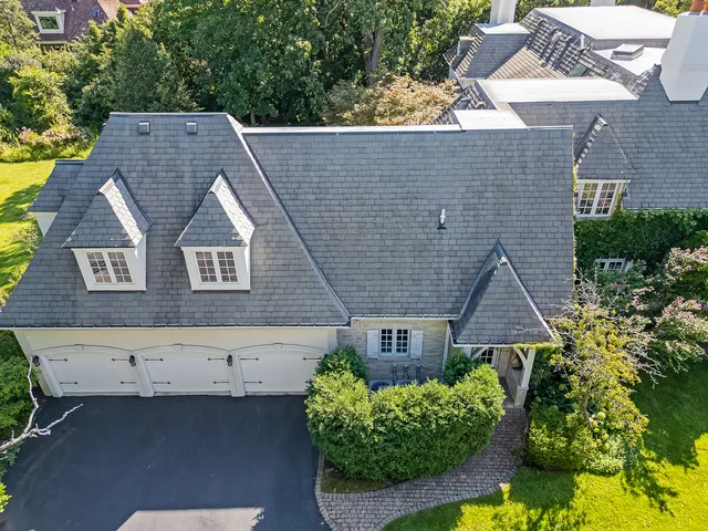a view of a patio with table and chairs and potted plants