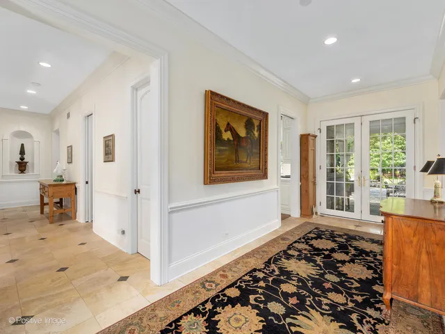a view of a bedroom with wooden floor