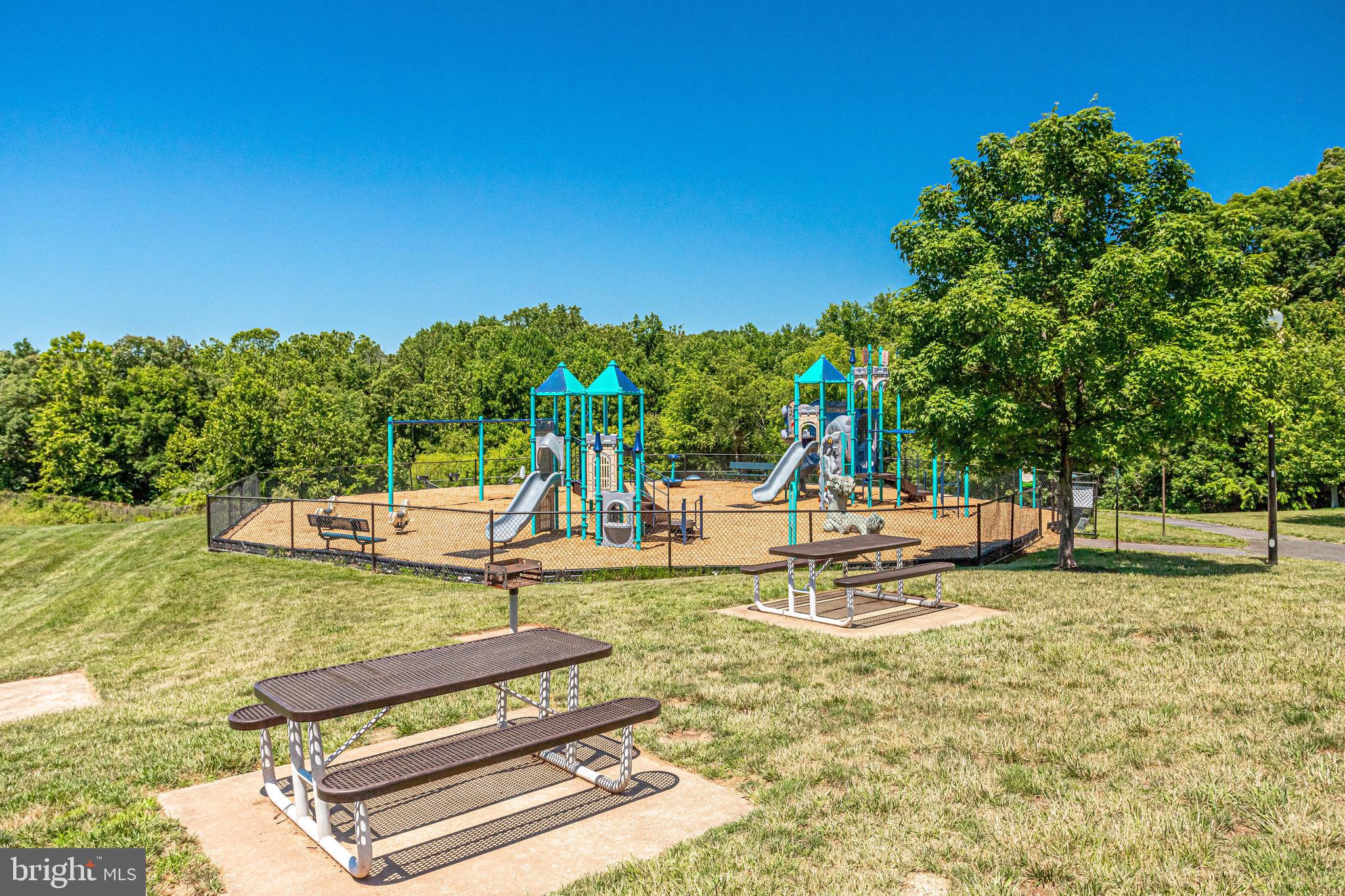 20876 Trinity Square Sterling, VA 20165 - Photo 46 of 50 a swimming pool with some trees in the background