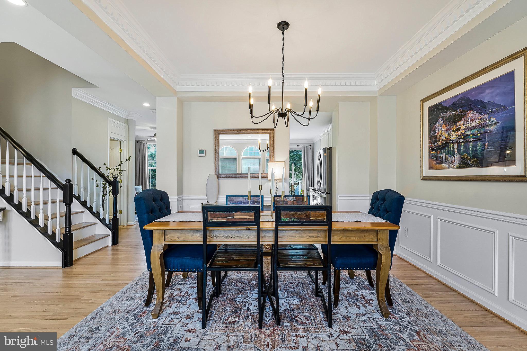 20876 Trinity Square Sterling, VA 20165 - Photo 8 of 50 a view of a dining room with furniture window and wooden floor