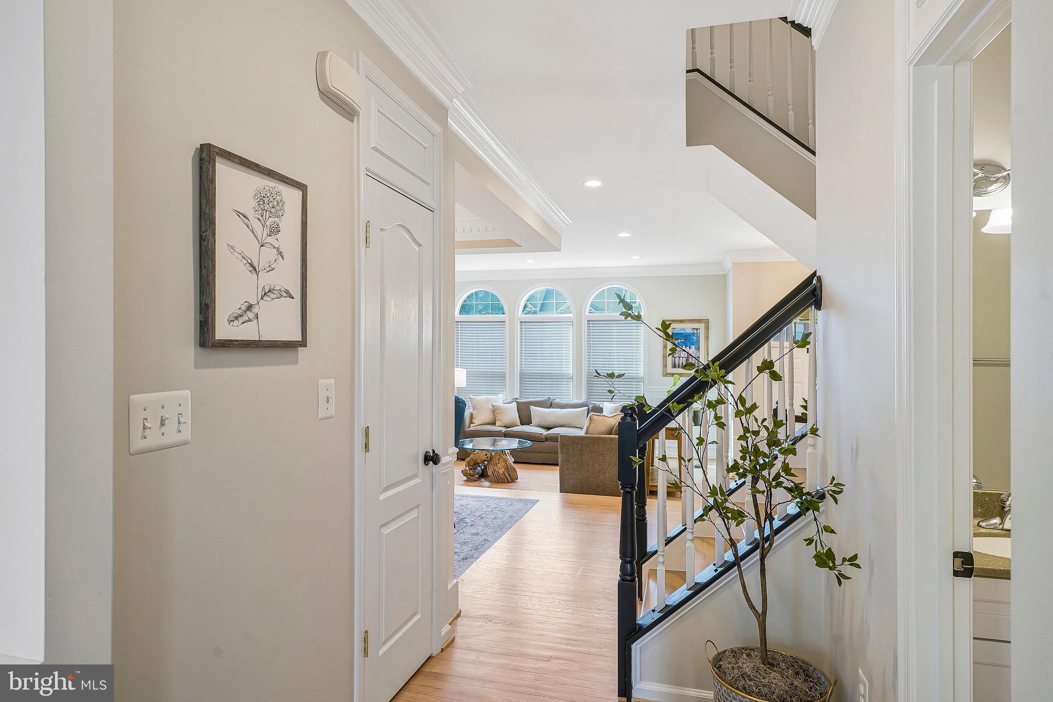 20876 Trinity Square Sterling, VA 20165 - Photo 9 of 50 a view of entryway with wooden floor and livingroom