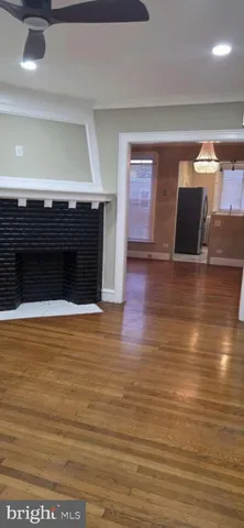 a view of kitchen and wooden floor