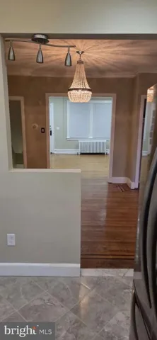 a view of a refrigerator in kitchen