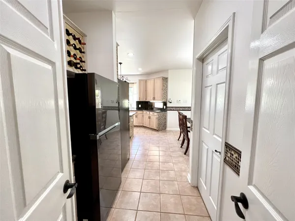 a kitchen with stainless steel appliances a refrigerator and a counter top space