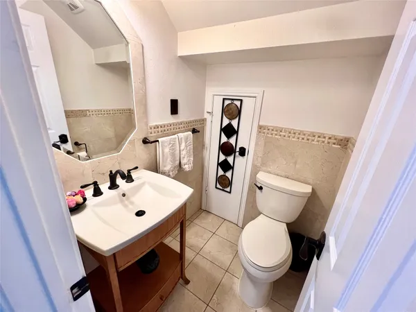 a living room with furniture and a piano