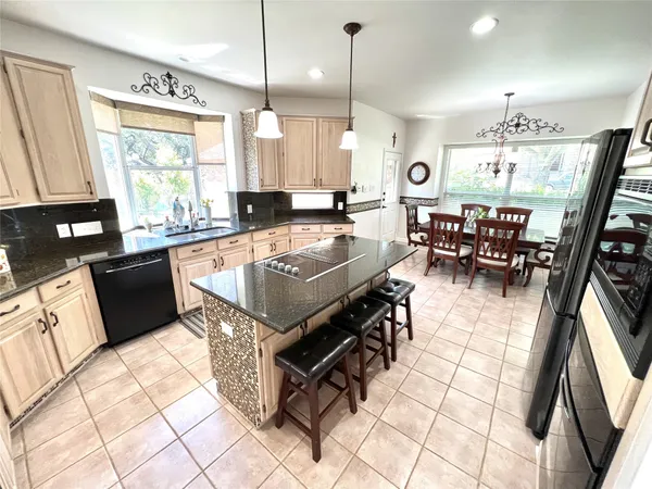 a large kitchen with lots of counter space and window