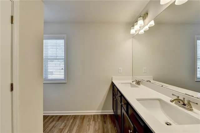 a bathroom with a sink a vanity and a mirror