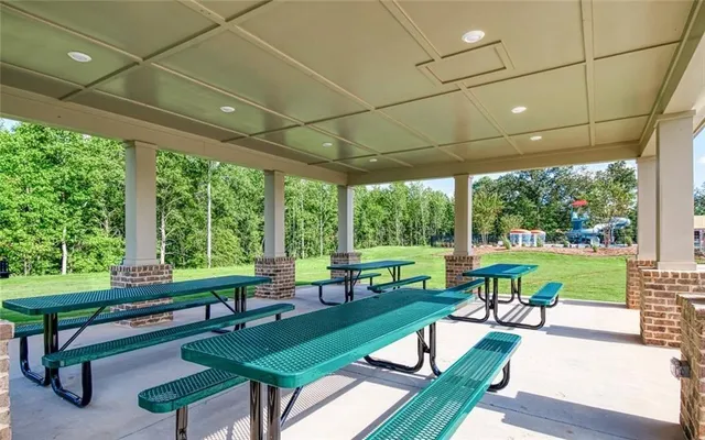 a view of a patio with chairs and a table