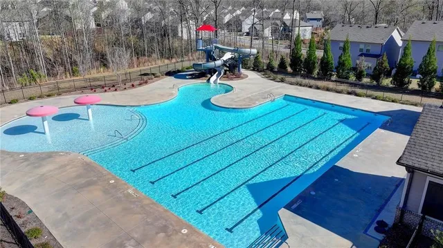 a view of a backyard with sitting area