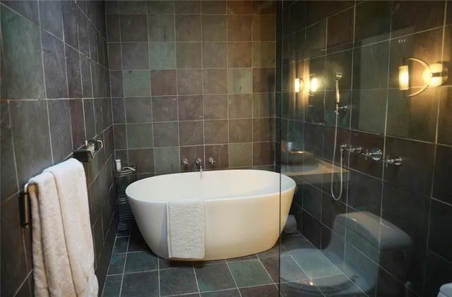 a white bath tub sitting in a bathroom