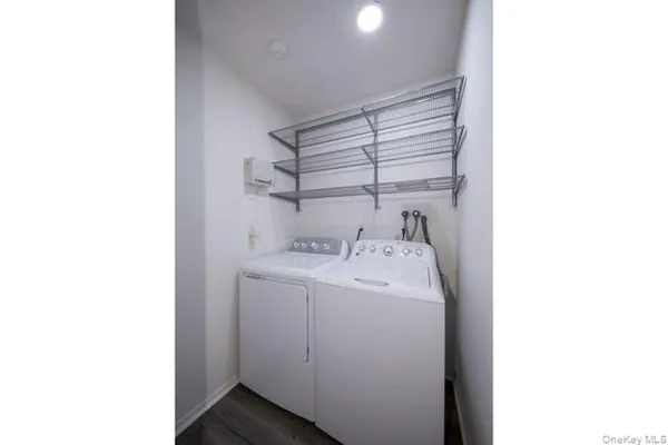 a utility room with a sink and washing machine
