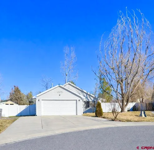 a view of a house with a snow in the yard
