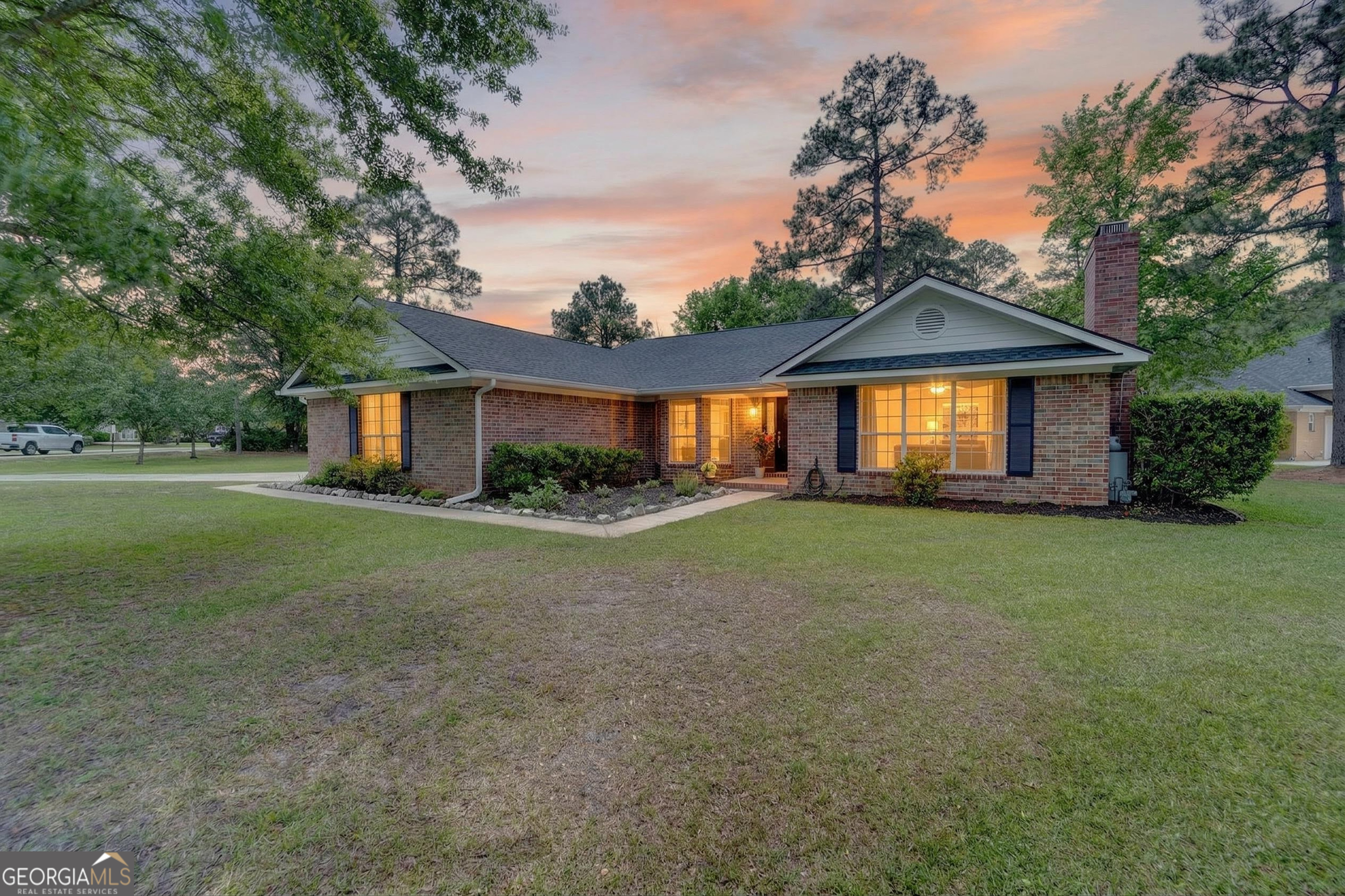 a front view of a house with a yard