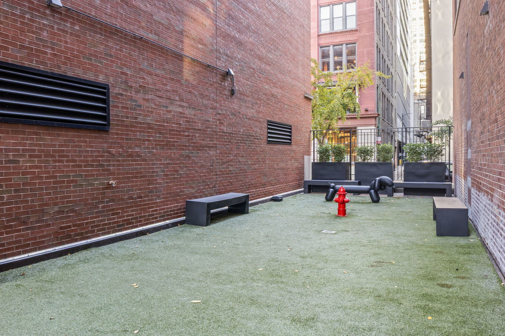 333 West Hubbard Street, Unit 502 Chicago, IL 60654 - Photo 16 of 18 a view of a patio with table and chairs and potted plants