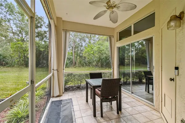 a dining room with furniture window and outside view