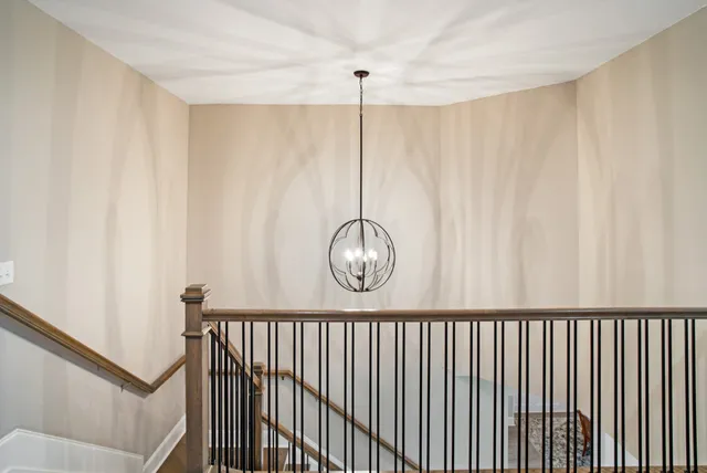 an aerial view of a house with a mountain