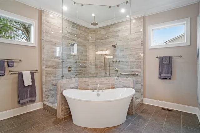 a view of a dining room and livingroom with furniture wooden floor a chandelier