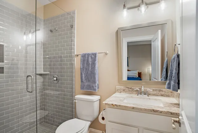 a front view of a house with yard and green space