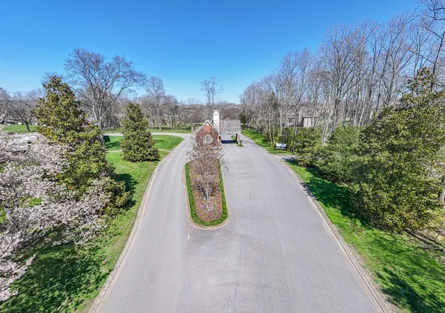 an aerial view of a house with garden space and street view