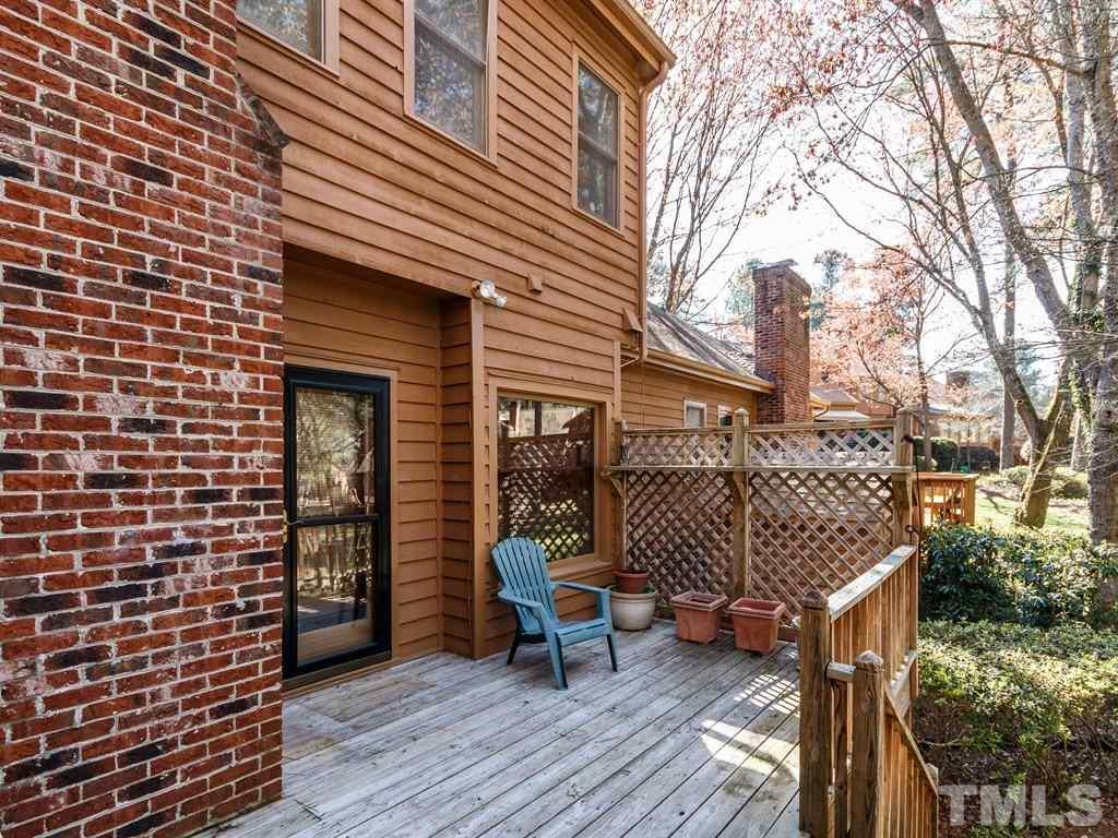 7651 Trowbridge Court Raleigh, NC 27613 - Photo 22 of 23 a view of a brick building with many windows