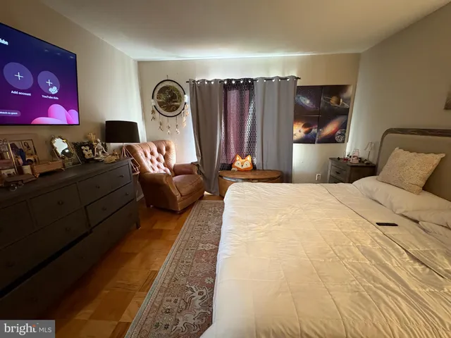 a bedroom with a bed and a walk in closet