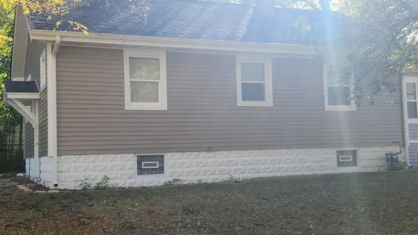 a view of a back yard of the house