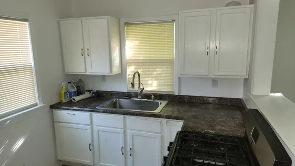 a bathroom with a toilet a sink and a mirror