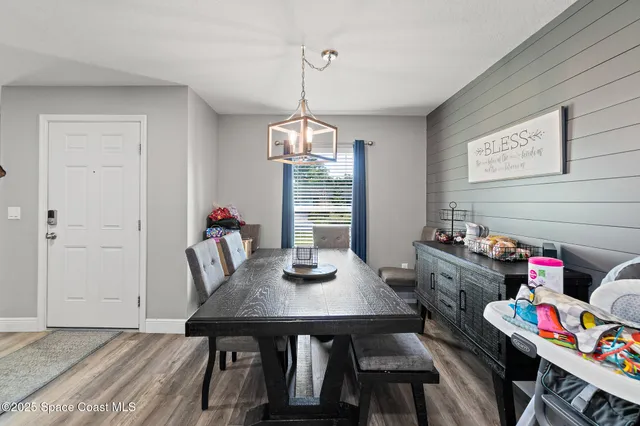 a view of a dining room with furniture window and outside view