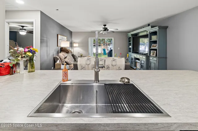 a view of kitchen with dining table and chairs