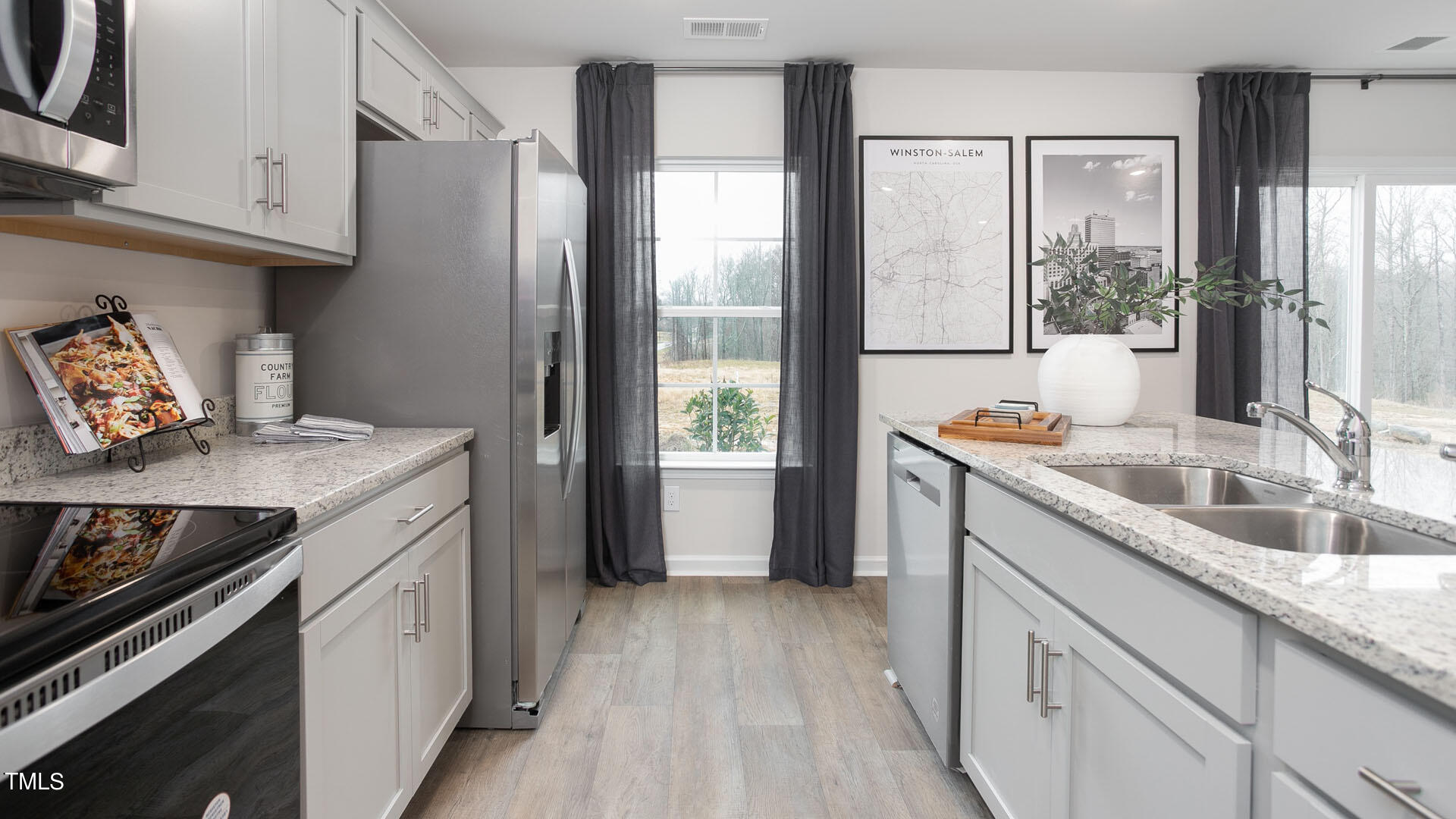 6025 Howth Way Raleigh, NC 27610 - Photo 11 of 30 a kitchen with a sink stove and refrigerator
