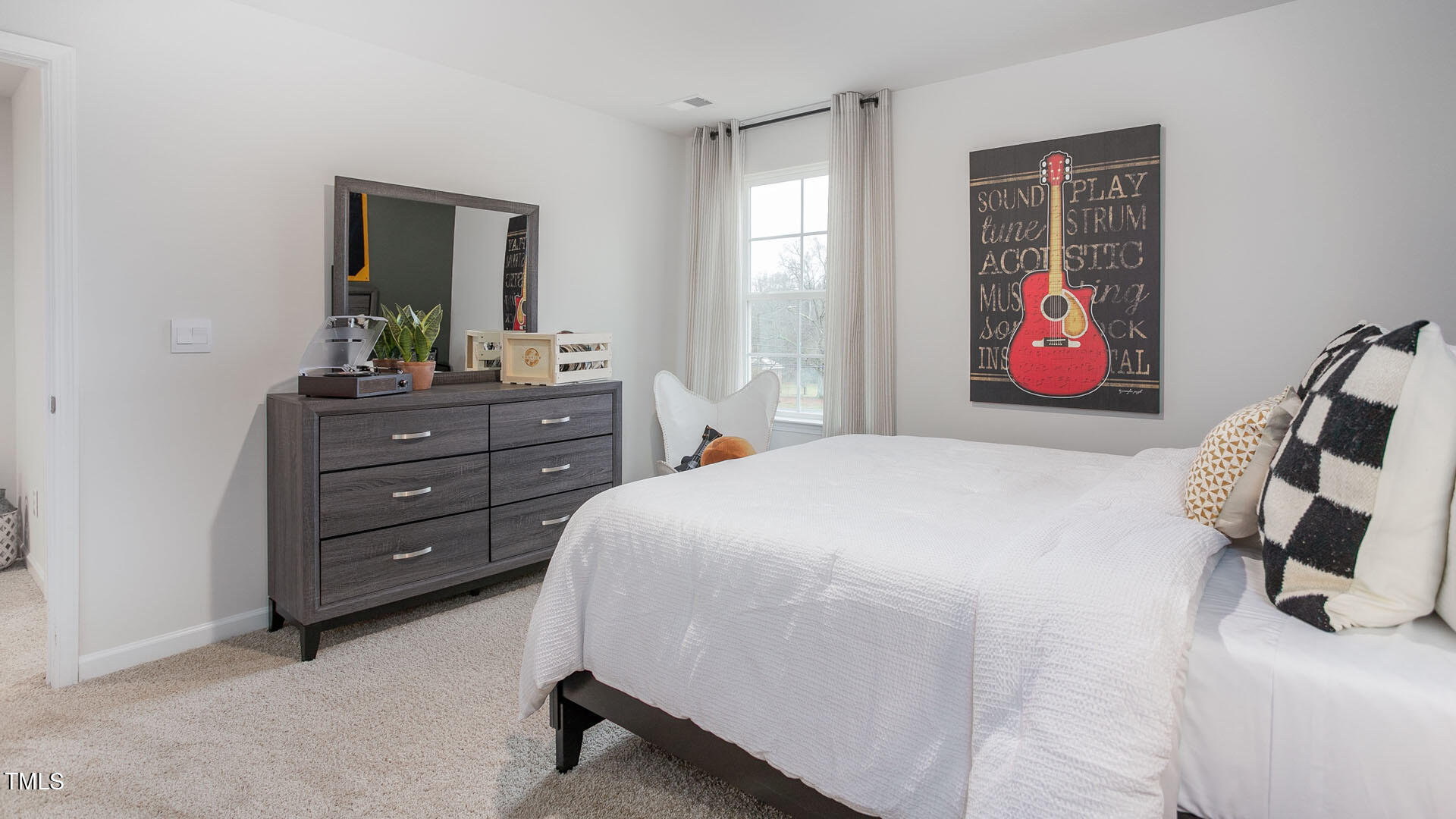6025 Howth Way Raleigh, NC 27610 - Photo 29 of 30 a bedroom with a bed and a dresser