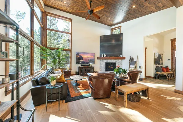 a living room with fireplace furniture and a flat screen tv