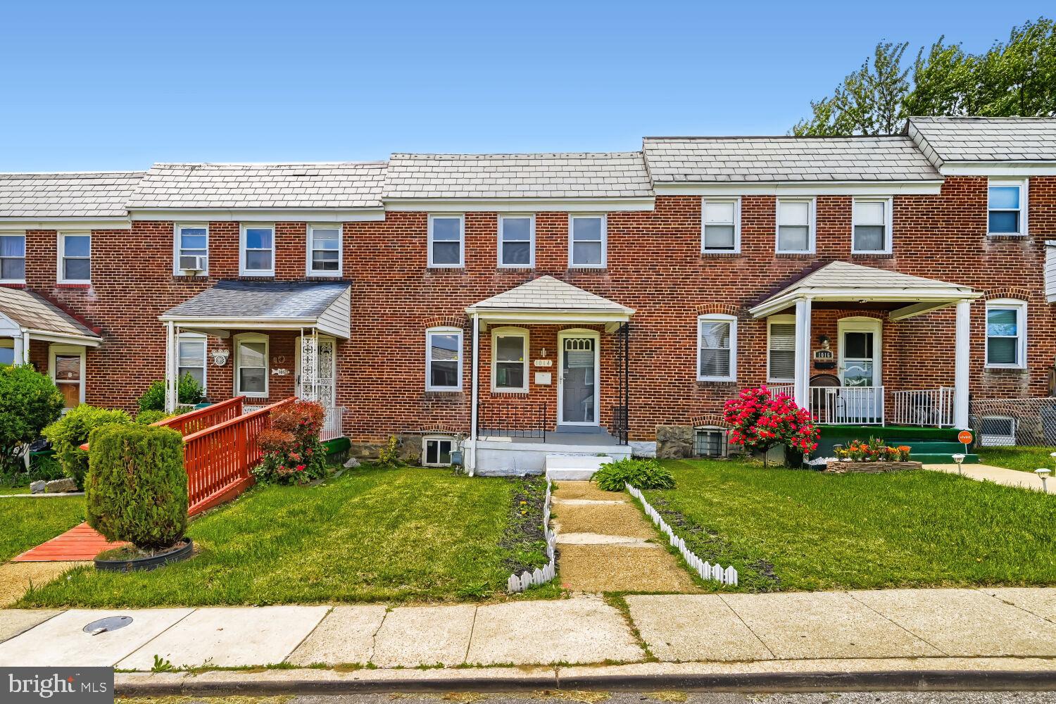1014 Lyndhurst Street Baltimore, MD 21229 - Photo 2 of 29 a front view of a house with garden