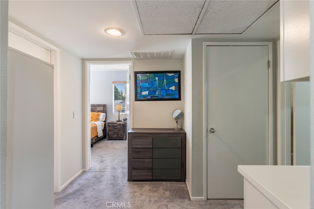 20253 Keswick Street Winnetka, CA 91306 - Photo 12 of 22 a view of a hallway to a livingroom and a livingroom with furniture