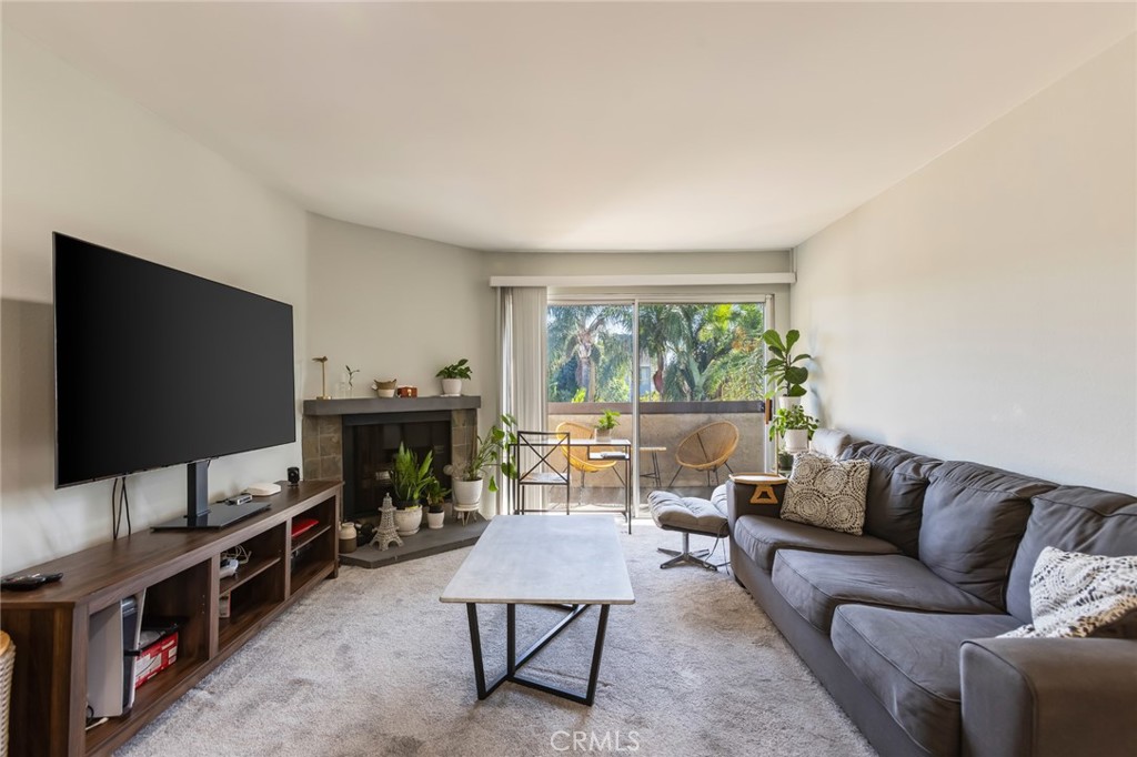 20253 Keswick Street Winnetka, CA 91306 - Photo 2 of 22 a living room with furniture and a flat screen tv