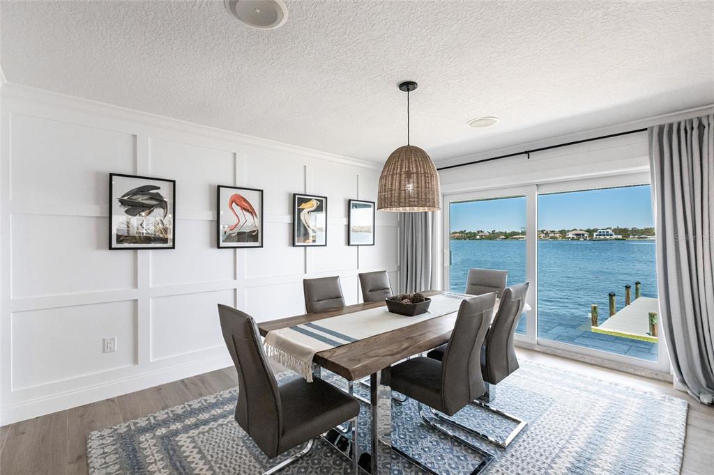 8115 Manasota Key Road Englewood, FL 34223 - Photo 32 of 67 a view of a dining room with furniture window and wooden floor