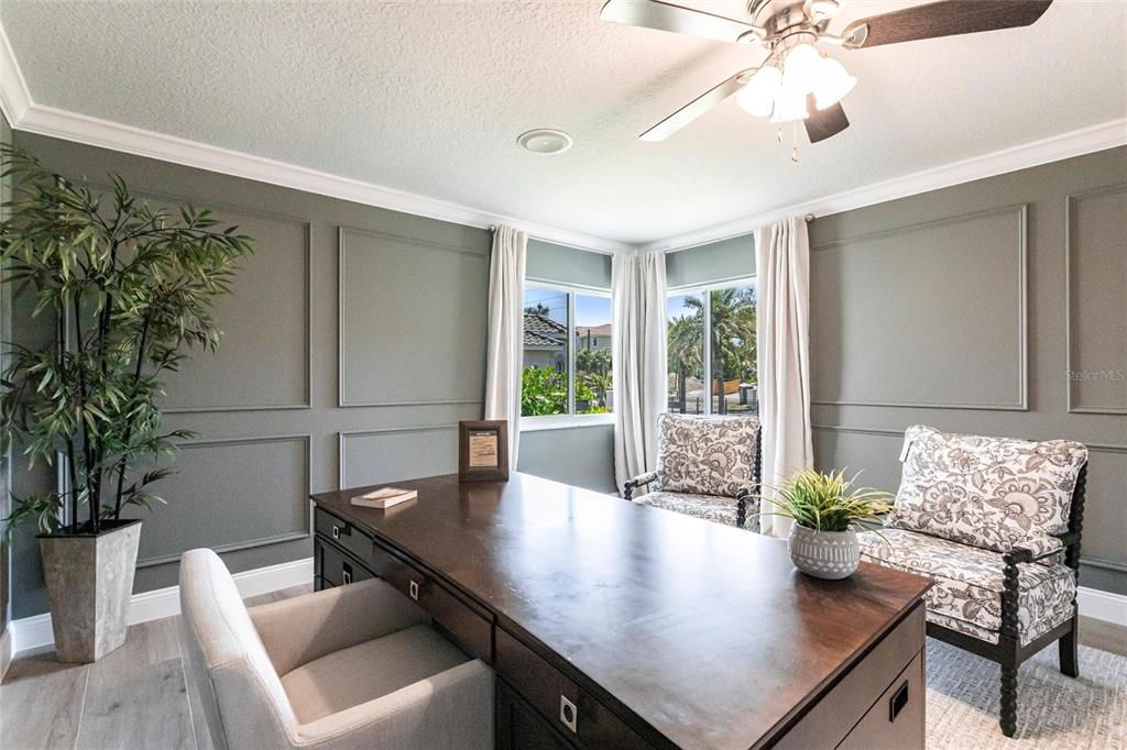 8115 Manasota Key Road Englewood, FL 34223 - Photo 47 of 67 a living room with furniture and a potted plant