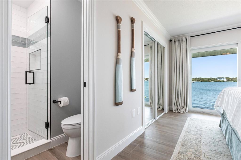 8115 Manasota Key Road Englewood, FL 34223 - Photo 56 of 67 a bathroom with a shower toilet and sink