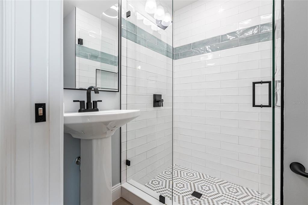 8115 Manasota Key Road Englewood, FL 34223 - Photo 57 of 67 a bathroom with a sink and a mirror