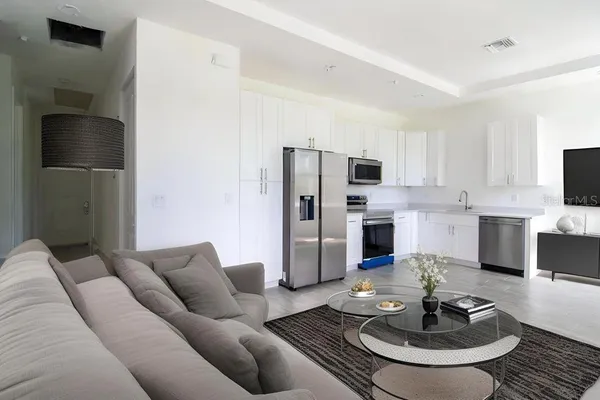a living room with furniture and a fireplace