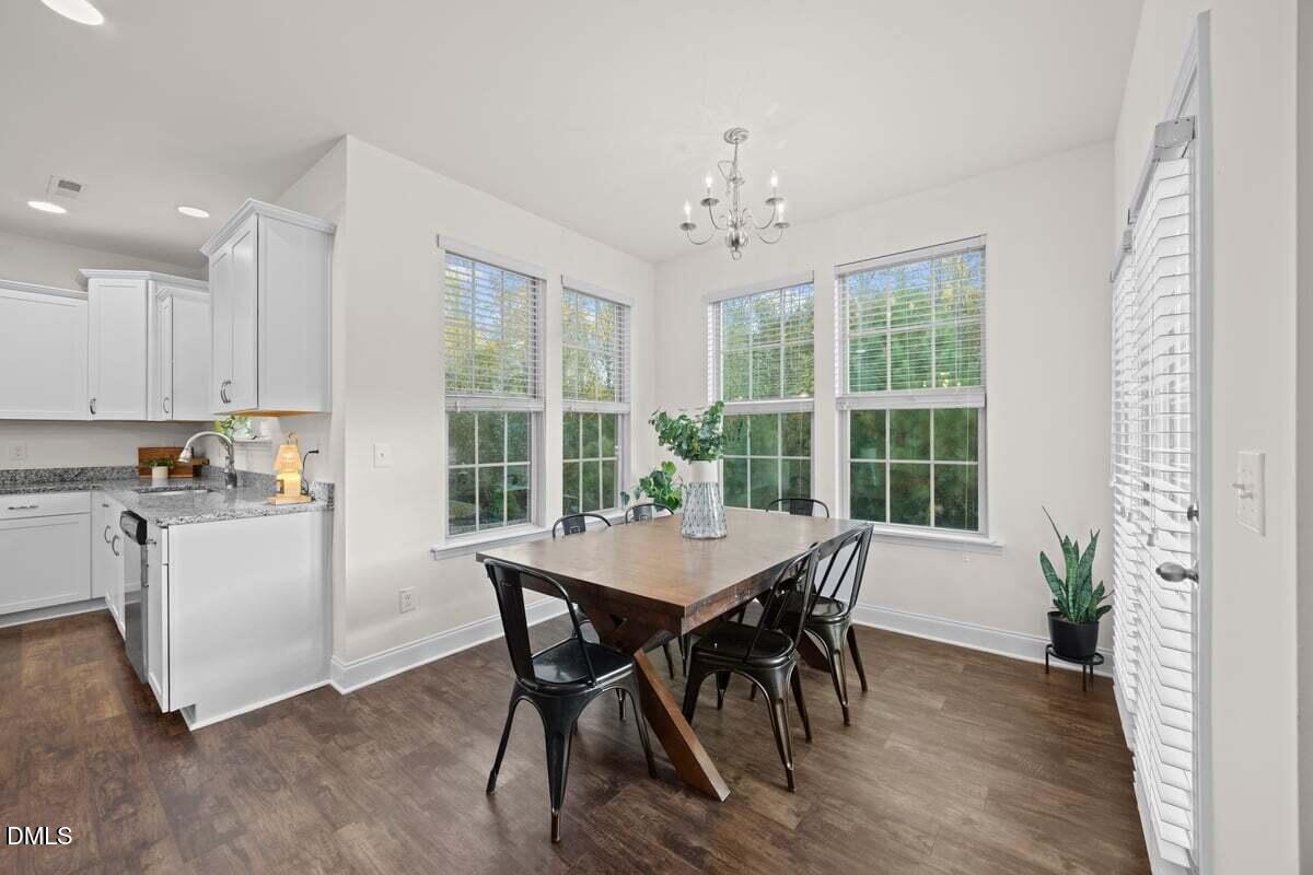 917 Stable Fern Drive Fuquay-Varina, NC 27526 - Photo 12 of 31 a view of a dining room with furniture window and outside view