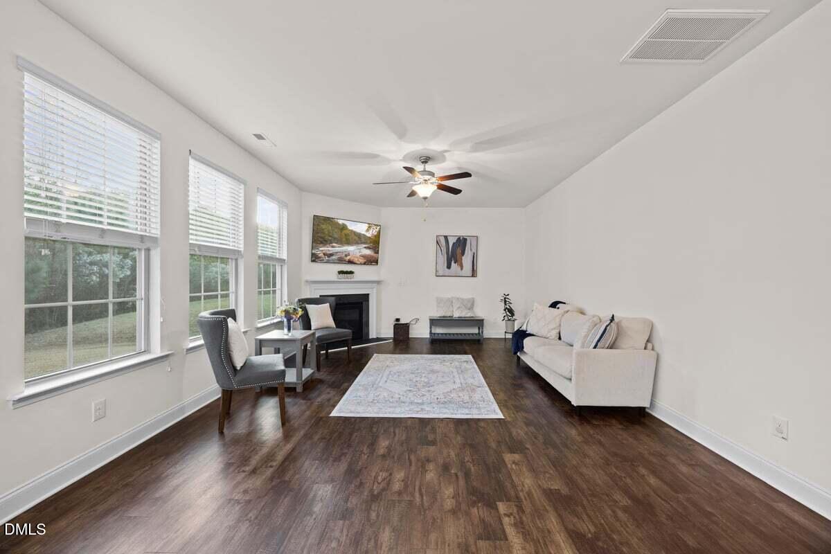 917 Stable Fern Drive Fuquay-Varina, NC 27526 - Photo 13 of 31 a living room with furniture and a fireplace