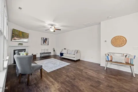 a view of a dining room with furniture and chandelier